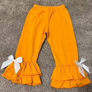 Orange boutique ruffle bottom pants